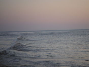 Scenic view of sea against clear sky during sunset