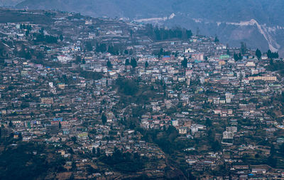 City urbanization view from hilltop with huge construction and dramatic sky