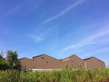 View of buildings against blue sky