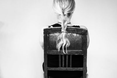 Portrait of a woman against white background