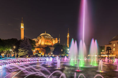 Panoramic view of illuminated buildings at night