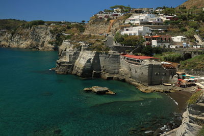 View of buildings by sea