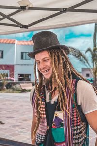 Smiling mature man with dreadlocks