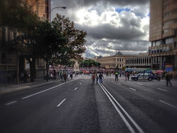 City street against cloudy sky