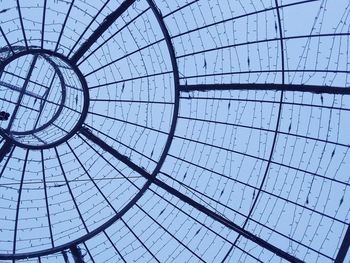 A wire frame christmas decoration viewed from below