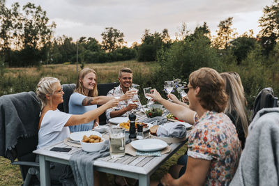 Friends having meal in garden