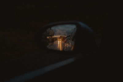 Reflection of car seen in mirror