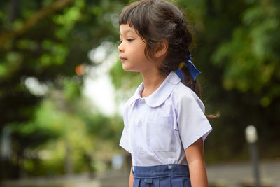Close-up of girl standing outdoors