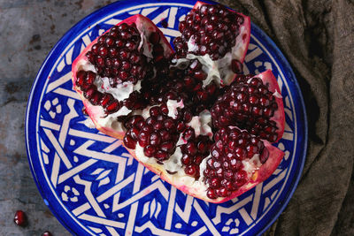 High angle view of pomegranate in plate on table