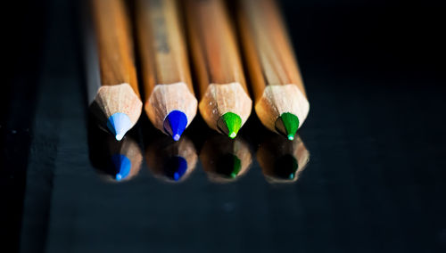 Close-up of multi colored pencils on table