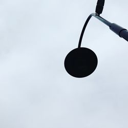 Low angle view of hanging against sky