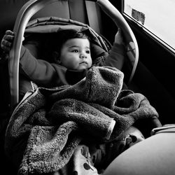 Cute girl sitting in car