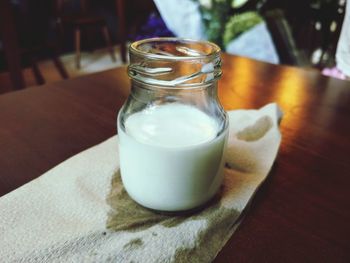 Close-up of milk in jar on table