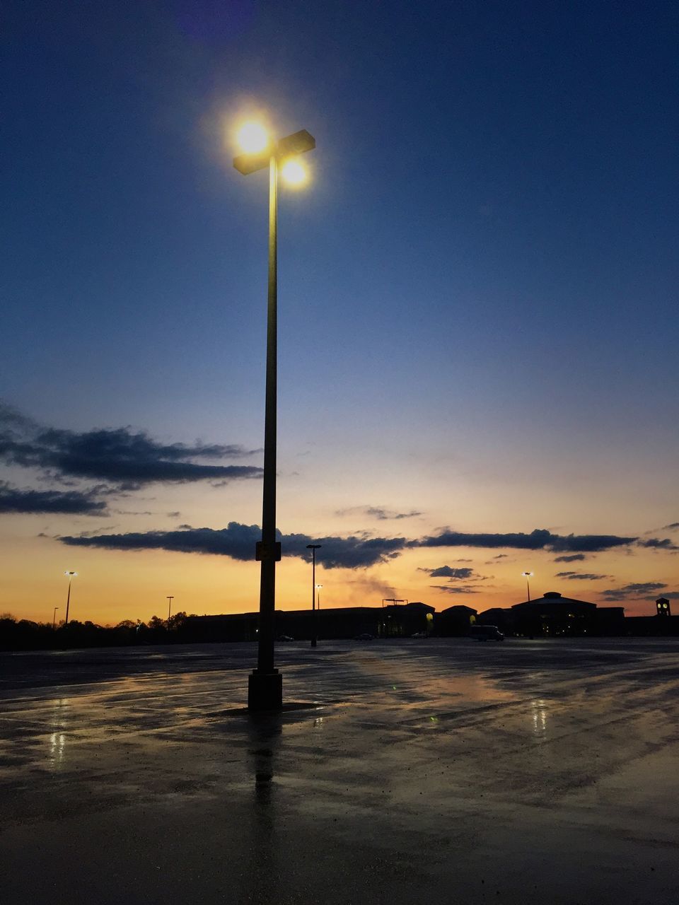 street light, sunset, sky, lighting equipment, silhouette, water, sea, pole, tranquility, dusk, built structure, outdoors, nature, cloud - sky, scenics, reflection, lamp post, no people, illuminated, building exterior