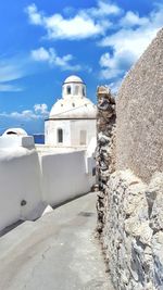 White building against cloudy sky