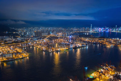 High angle view of illuminated buildings in city at night