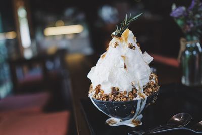 Close-up of ice cream served on table