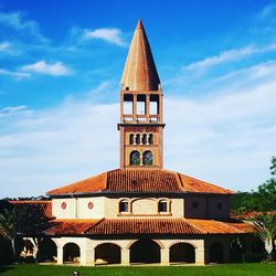 Low angle view of church against cloudy sky