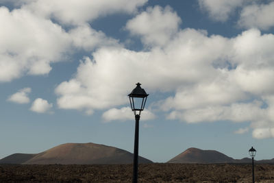 Low angle view of street light against sky