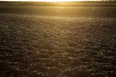 Aerial view of sea against sky at sunset