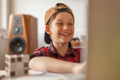 Portrait of smiling boy at home