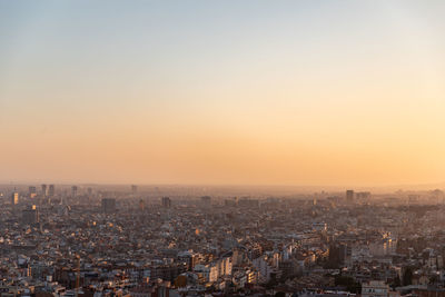 High angle view of city against sky during sunset