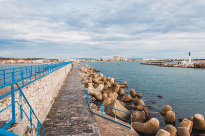 Pier over sea against sky