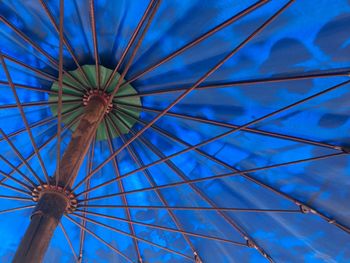 Low angle view of ferris wheel against sky