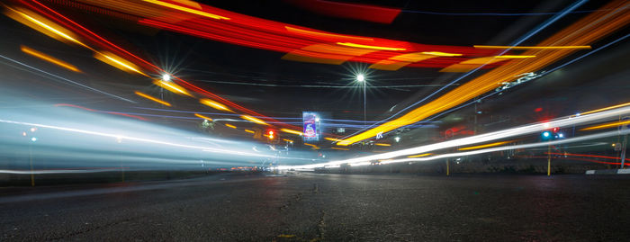 Light trails on road in city at night