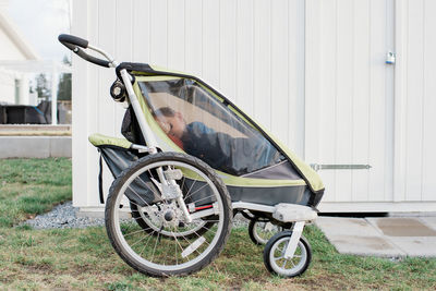 Kid sleeping in a stroller outside in sweden