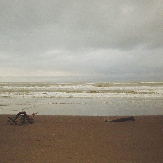 beach, sea, horizon over water, sand, shore, sky, water, cloud - sky, tranquility, cloudy, scenics, tranquil scene, beauty in nature, nature, cloud, wave, idyllic, overcast, coastline, weather