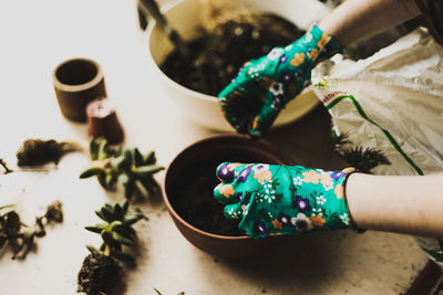 High angle view of woman preparing food on table