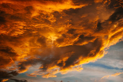 Low angle view of dramatic sky during sunset