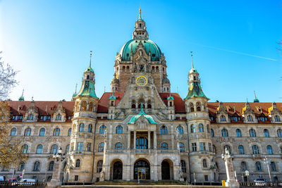 Low angle view of building against blue sky