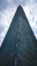 Low angle view of building against cloudy sky