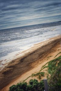 Scenic view of sea against cloudy sky