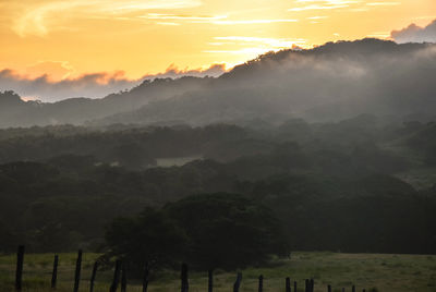 Scenic view of landscape against sky during sunset