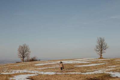 Scenic view of field against sky during winter