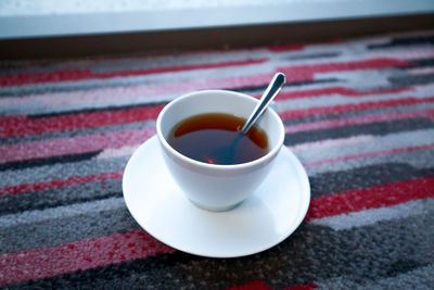 Close-up of coffee cup on table