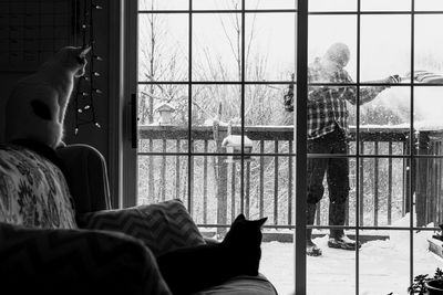 Man sitting by window