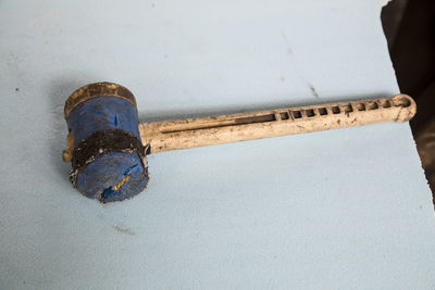 High angle view of hammer on table