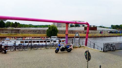 Bicycles on shore against sky