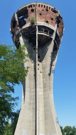 Low angle view of built structure against clear blue sky