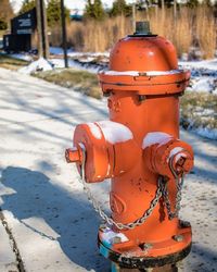 Close-up of fire hydrant on footpath during winter