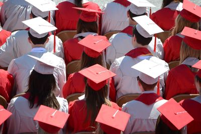 High angle view of students wearing graduation gown at university