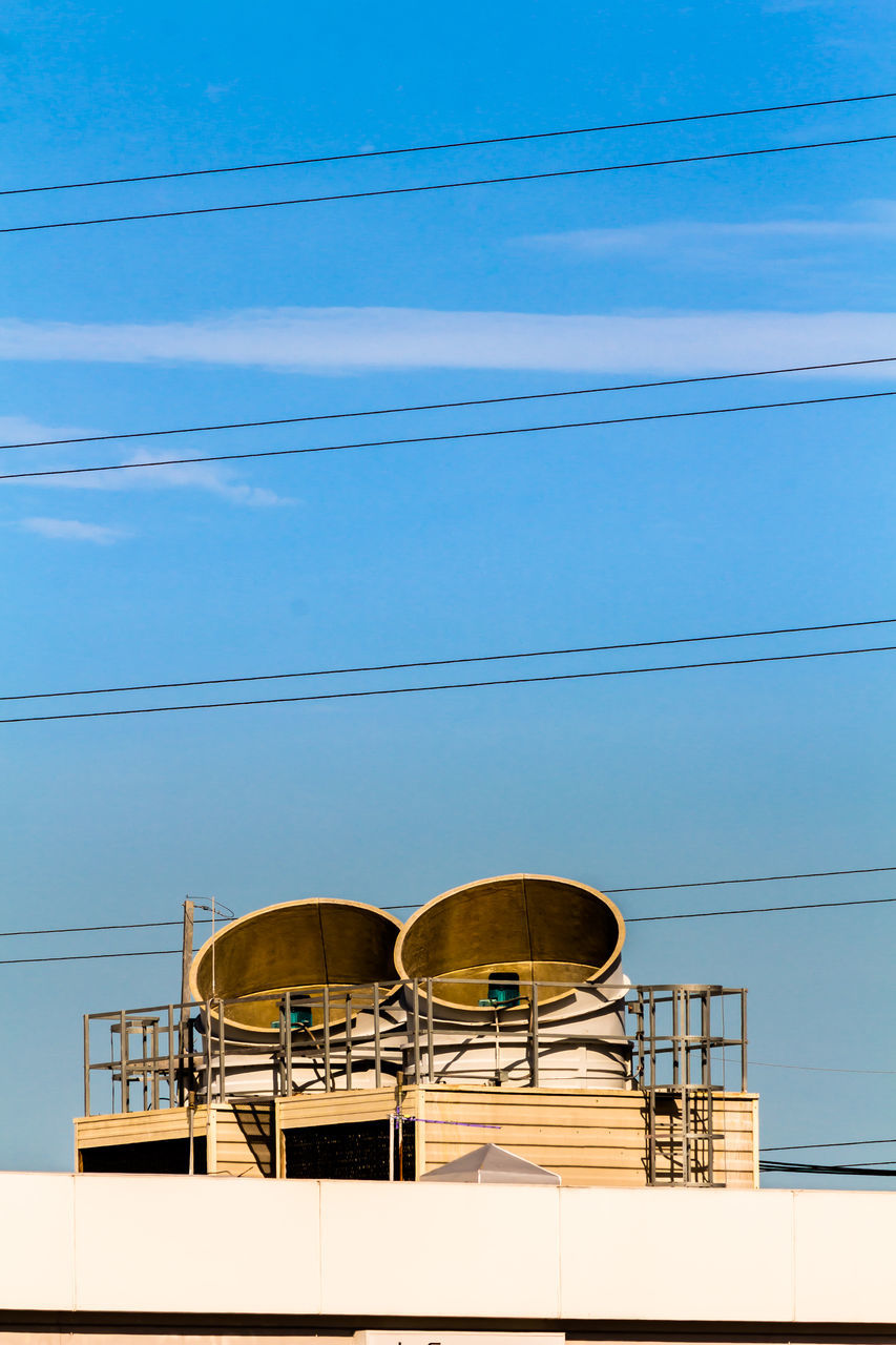 LOW ANGLE VIEW OF CABLES AGAINST BLUE SKY