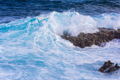 Waves splashing on rocks