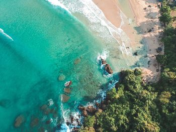 High angle view of people swimming in sea