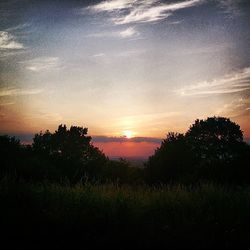 Scenic view of landscape against sky during sunset