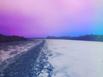 Scenic view of sea against sky during winter